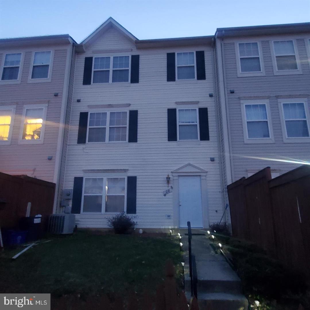 5086 Stapleton Terrace Frederick, MD 21703 - Photo 1 of 24 a brick building with a black door