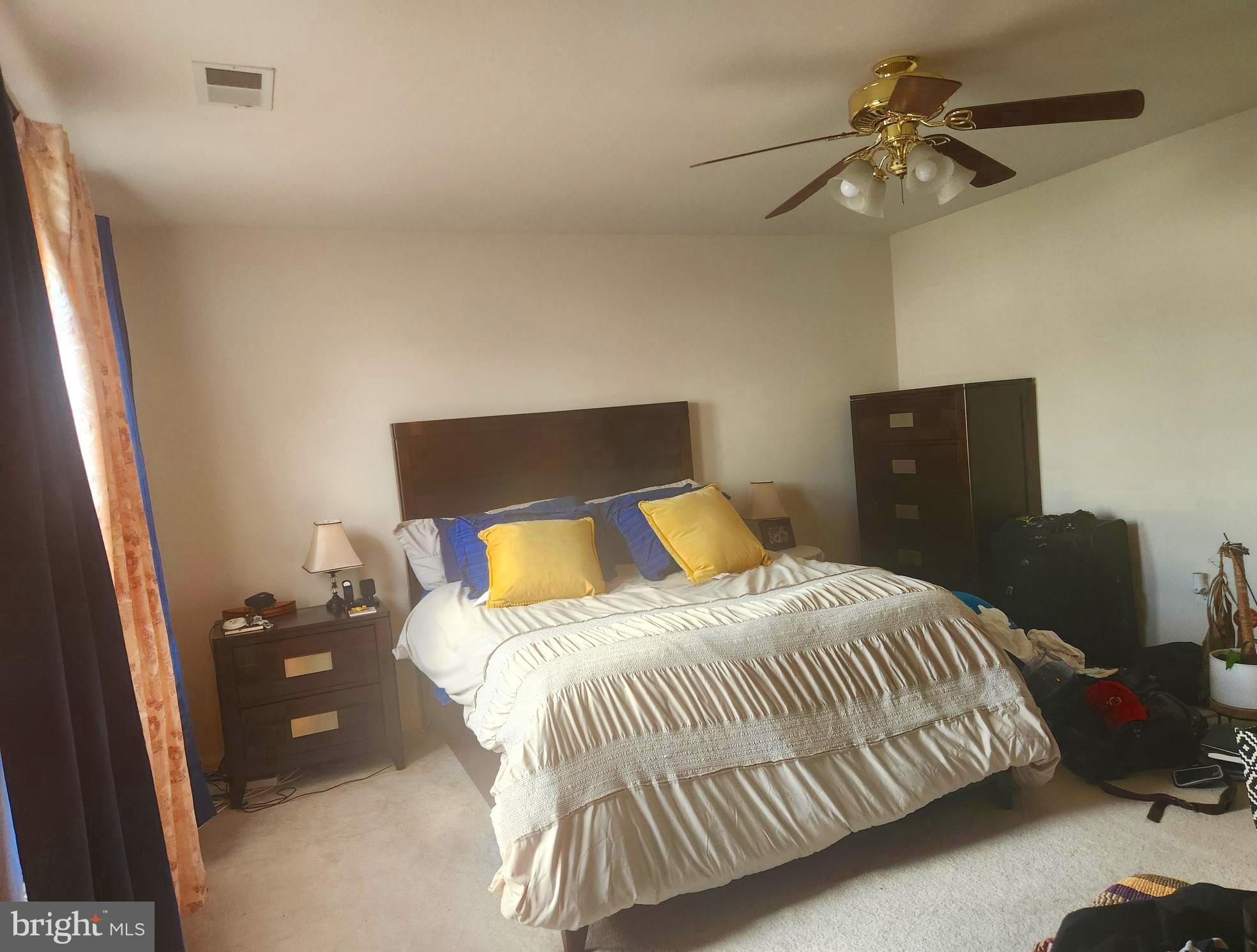 5086 Stapleton Terrace Frederick, MD 21703 - Photo 8 of 24 a bedroom with a bed and a ceiling fan