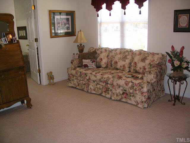1017 Linden Crest Road Raleigh, NC 27603 - Photo 4 of 10 a living room with furniture and a window