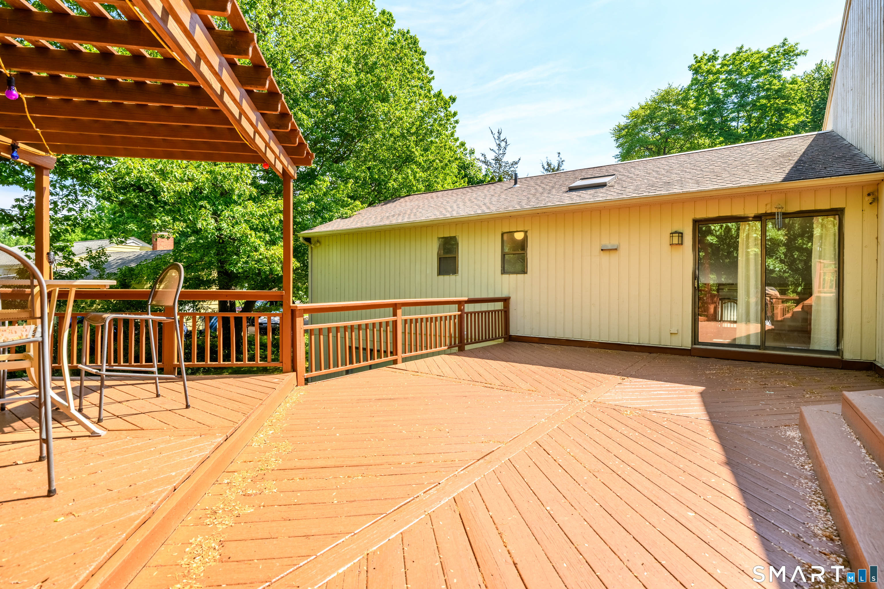 90 Bell Street Manchester, CT 06040 - Photo 37 of 40 a view of a deck with wooden floor and outer view