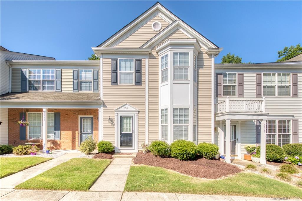 6921 Rothchild Drive Charlotte, NC 28270 - Photo 1 of 26 a front view of a house with a yard