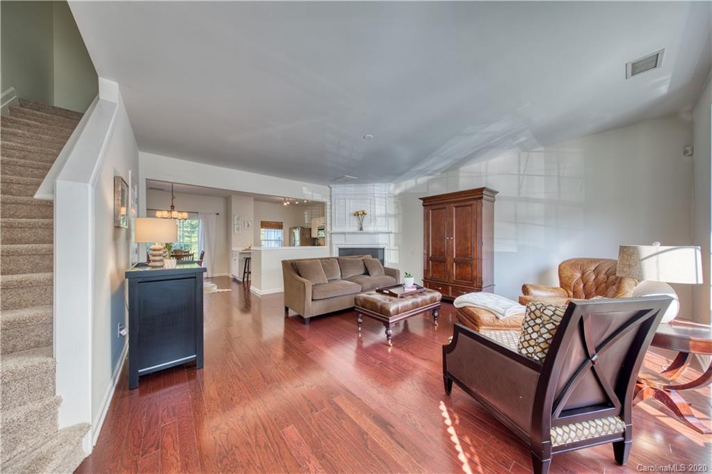 6921 Rothchild Drive Charlotte, NC 28270 - Photo 2 of 26 a living room with furniture and a wooden floor
