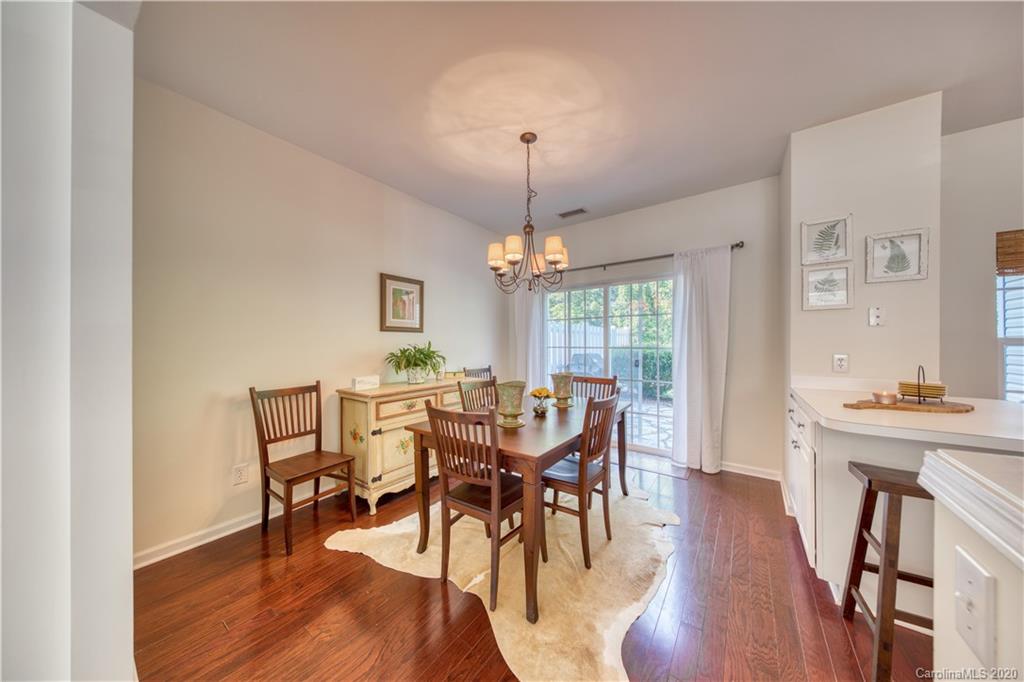6921 Rothchild Drive Charlotte, NC 28270 - Photo 11 of 26 a view of a dining room with furniture window and wooden floor
