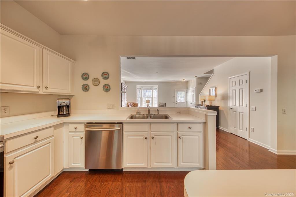 6921 Rothchild Drive Charlotte, NC 28270 - Photo 18 of 26 a kitchen with white cabinets and sink