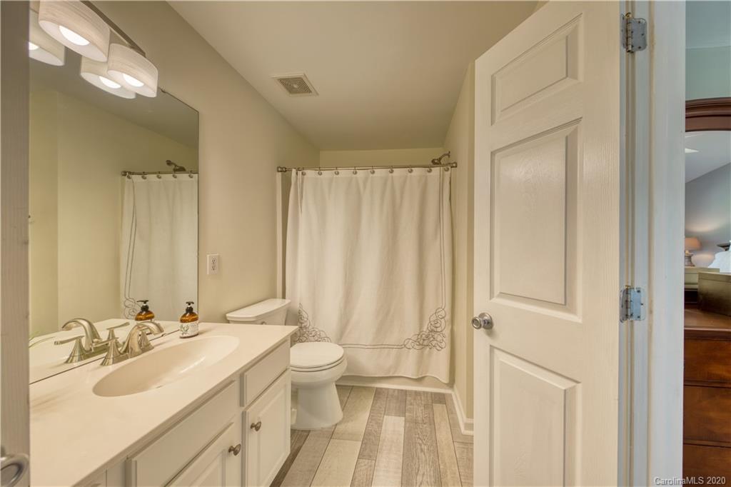 6921 Rothchild Drive Charlotte, NC 28270 - Photo 20 of 26 a bathroom with a double vanity sink and a mirror