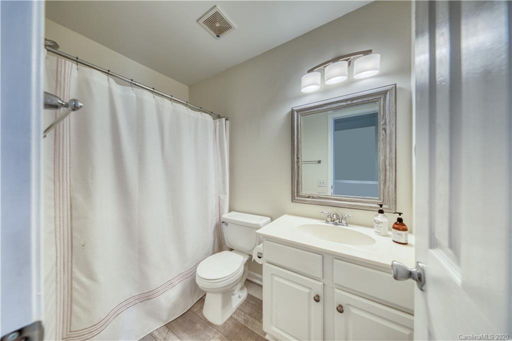 6921 Rothchild Drive Charlotte, NC 28270 - Photo 23 of 26 a bathroom with a sink a toilet and shower