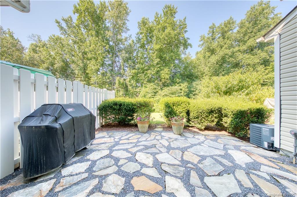 6921 Rothchild Drive Charlotte, NC 28270 - Photo 25 of 26 a view of a backyard with sitting area
