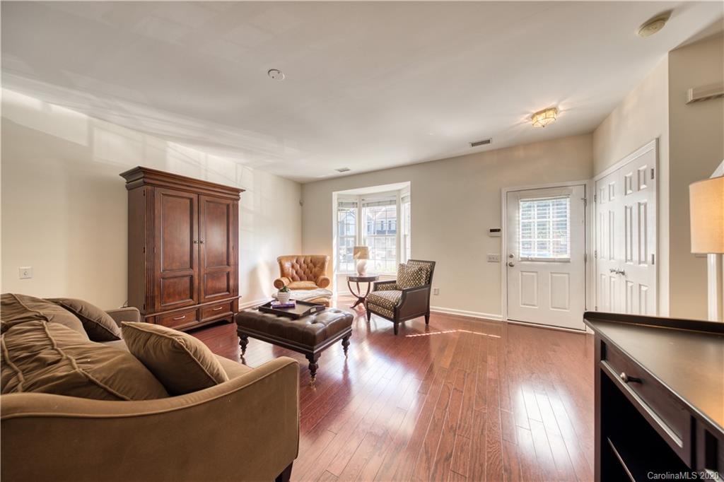 6921 Rothchild Drive Charlotte, NC 28270 - Photo 4 of 26 a living room with furniture and wooden floor