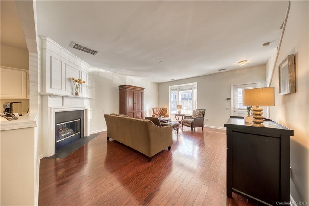 6921 Rothchild Drive Charlotte, NC 28270 - Photo 5 of 26 a living room with furniture a fireplace and a flat screen tv