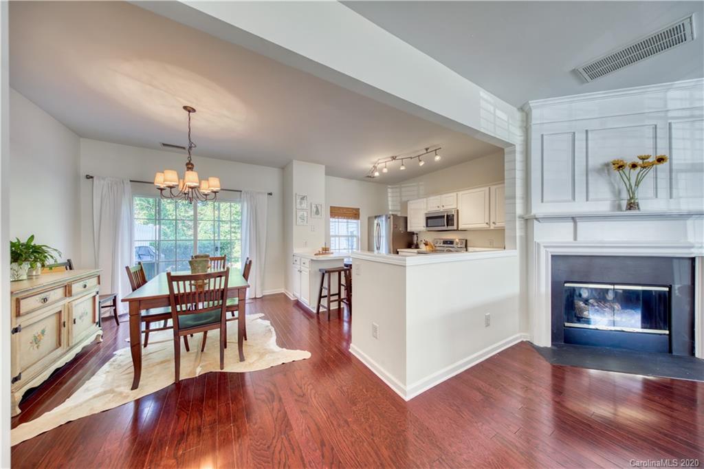 6921 Rothchild Drive Charlotte, NC 28270 - Photo 10 of 26 a living room with furniture and a fireplace