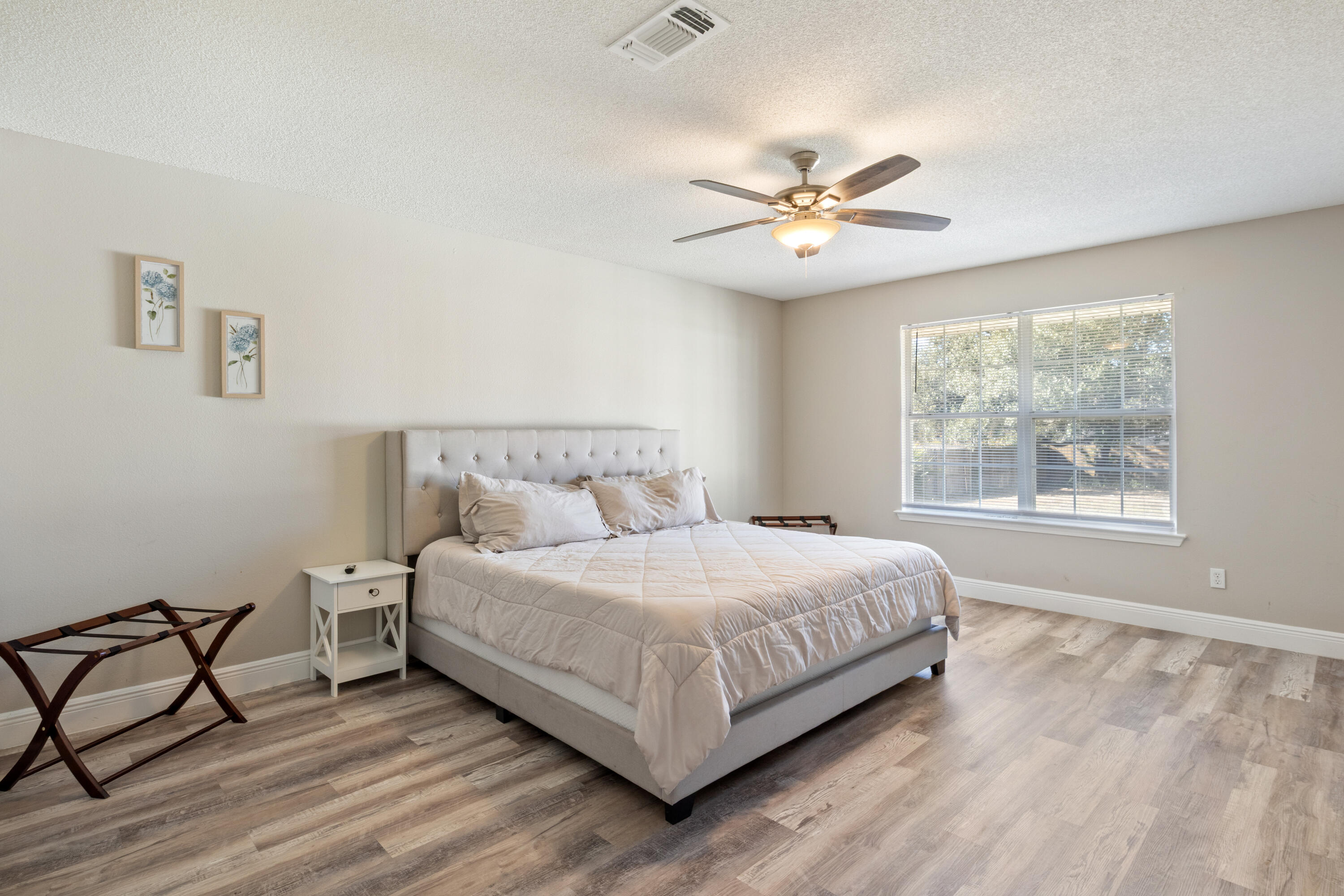 2005 Cardinal Lane Navarre, FL 32566 - Photo 14 of 37 a large bedroom with a bed and a window