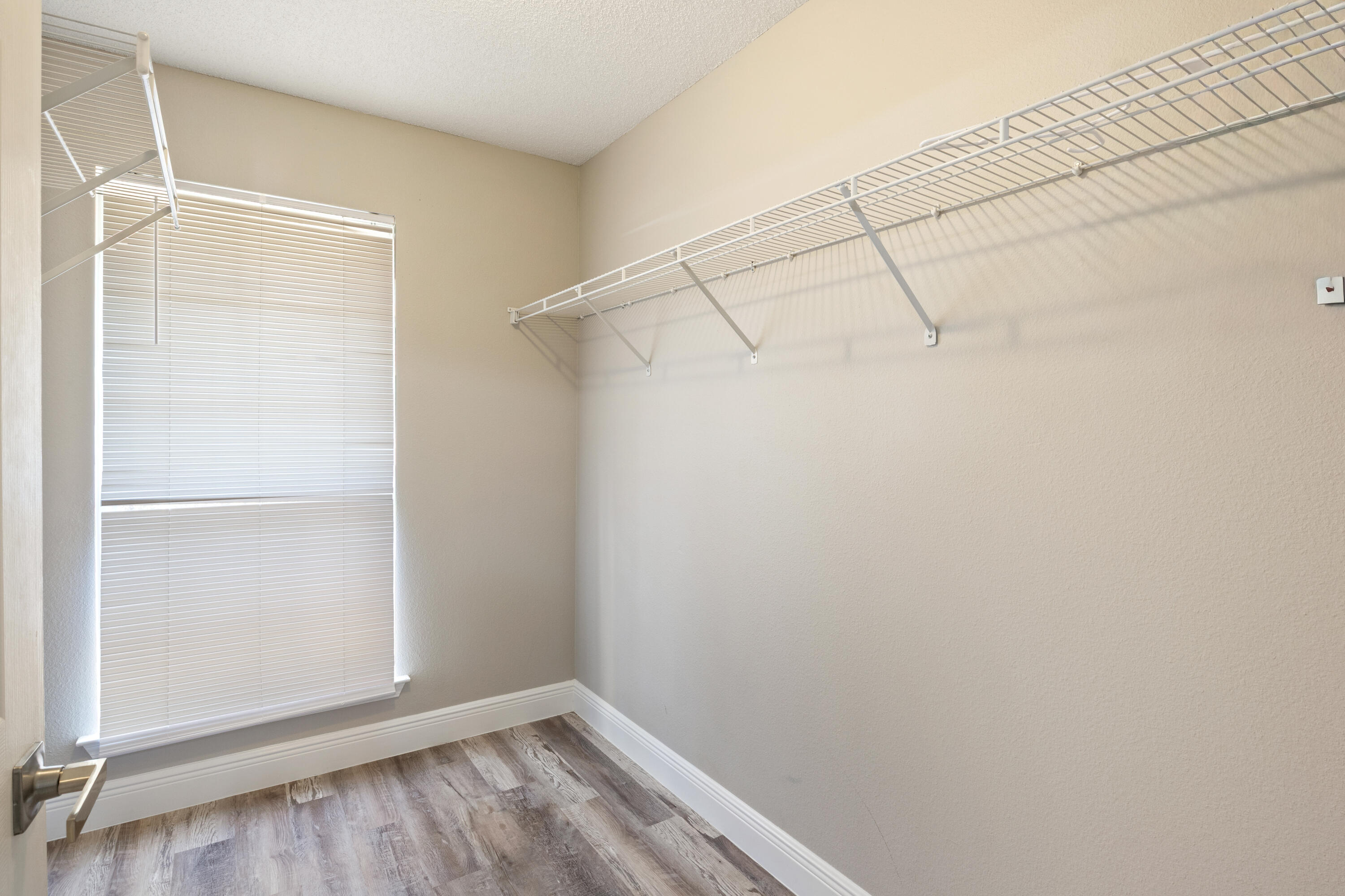 2005 Cardinal Lane Navarre, FL 32566 - Photo 20 of 37 a view of a room with racks on the wall