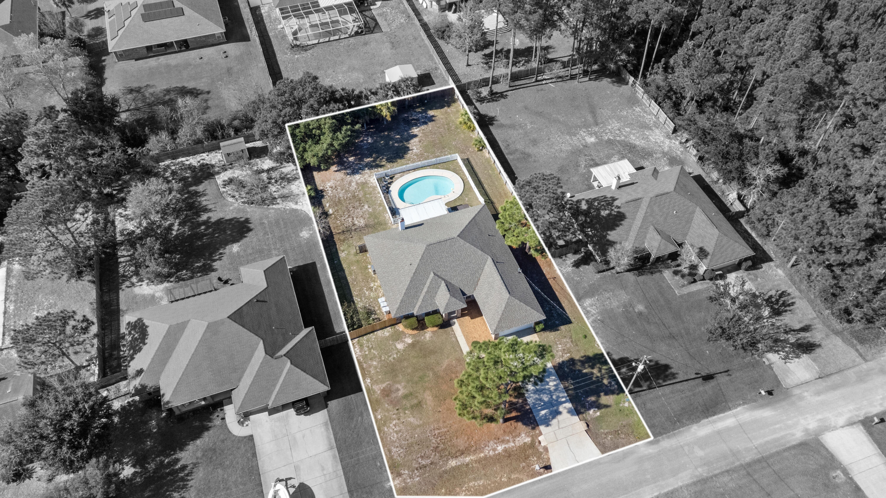 2005 Cardinal Lane Navarre, FL 32566 - Photo 2 of 37 an aerial view of a house outdoor space and street view