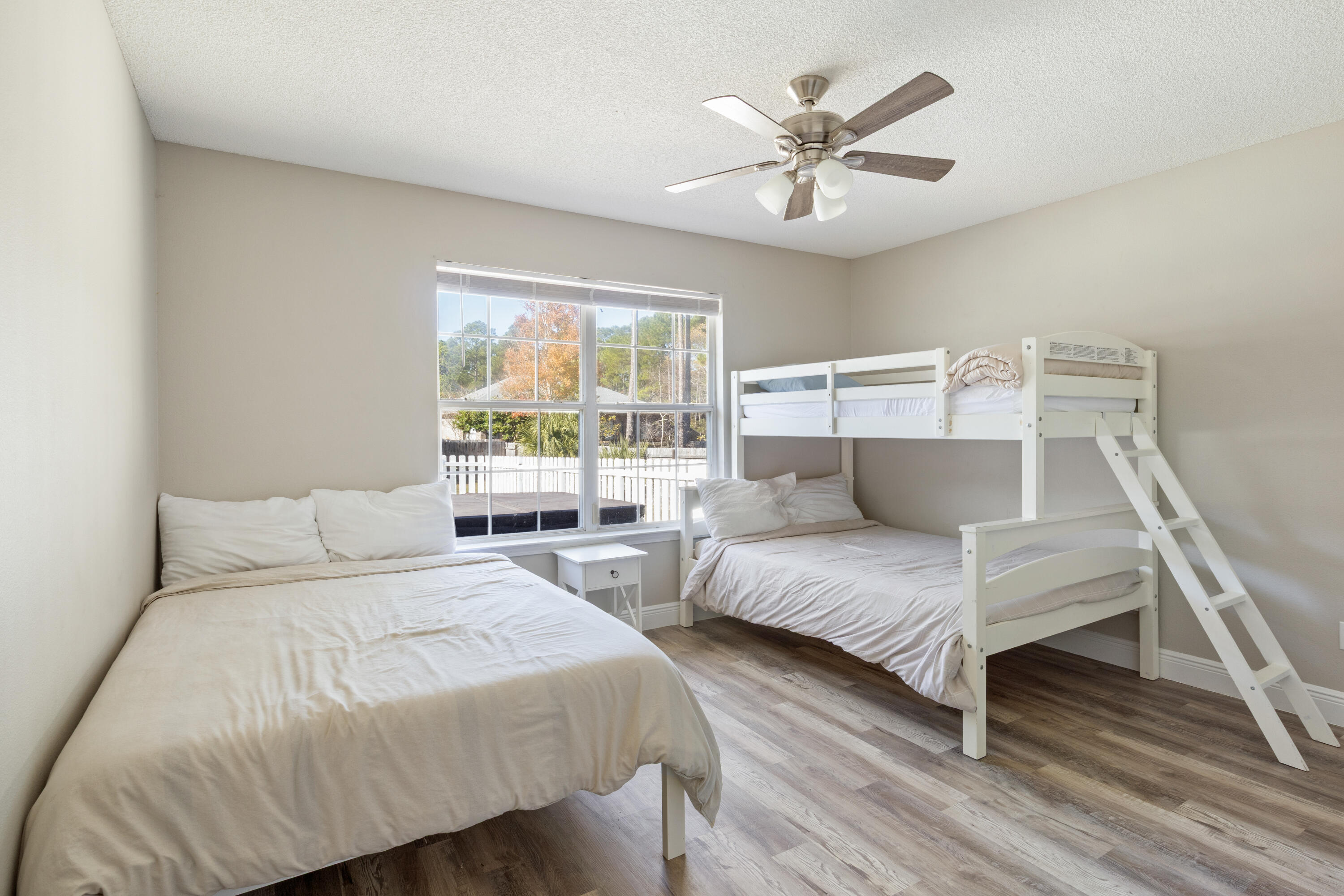 2005 Cardinal Lane Navarre, FL 32566 - Photo 21 of 37 a bedroom with two beds and window