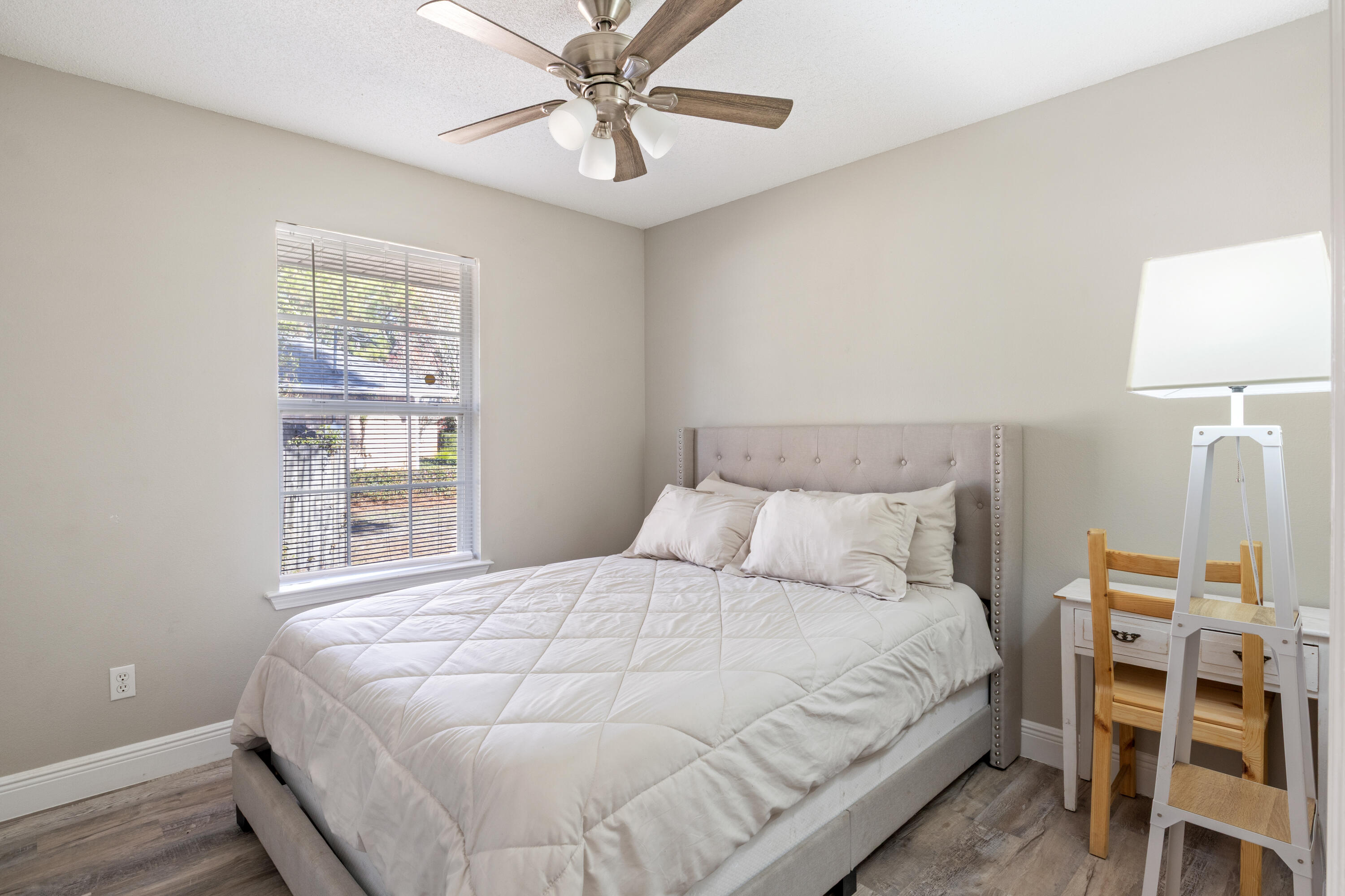 2005 Cardinal Lane Navarre, FL 32566 - Photo 22 of 37 a bedroom with a bed and a window
