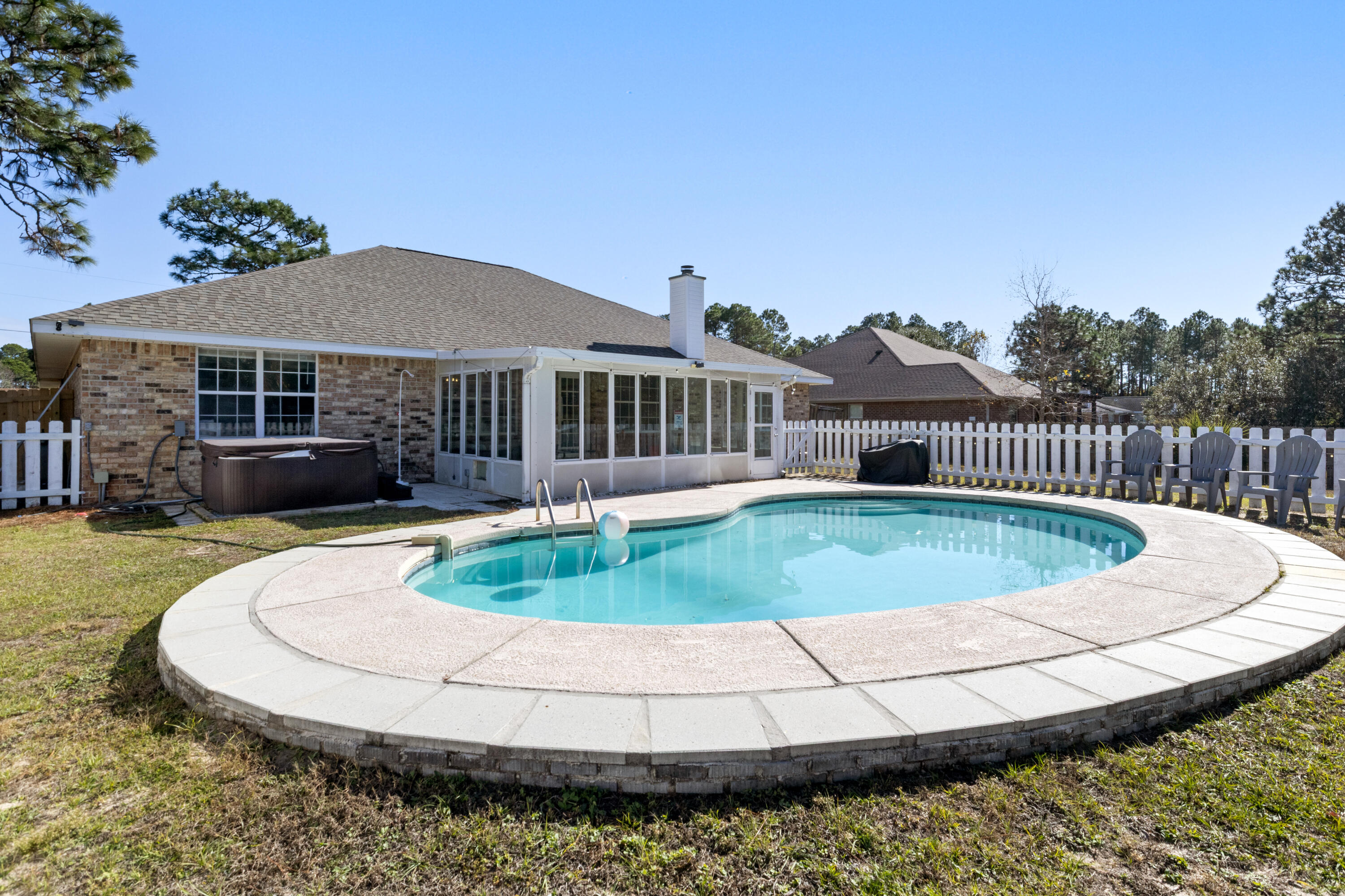 2005 Cardinal Lane Navarre, FL 32566 - Photo 29 of 37 a view of a house with a swimming pool and a yard