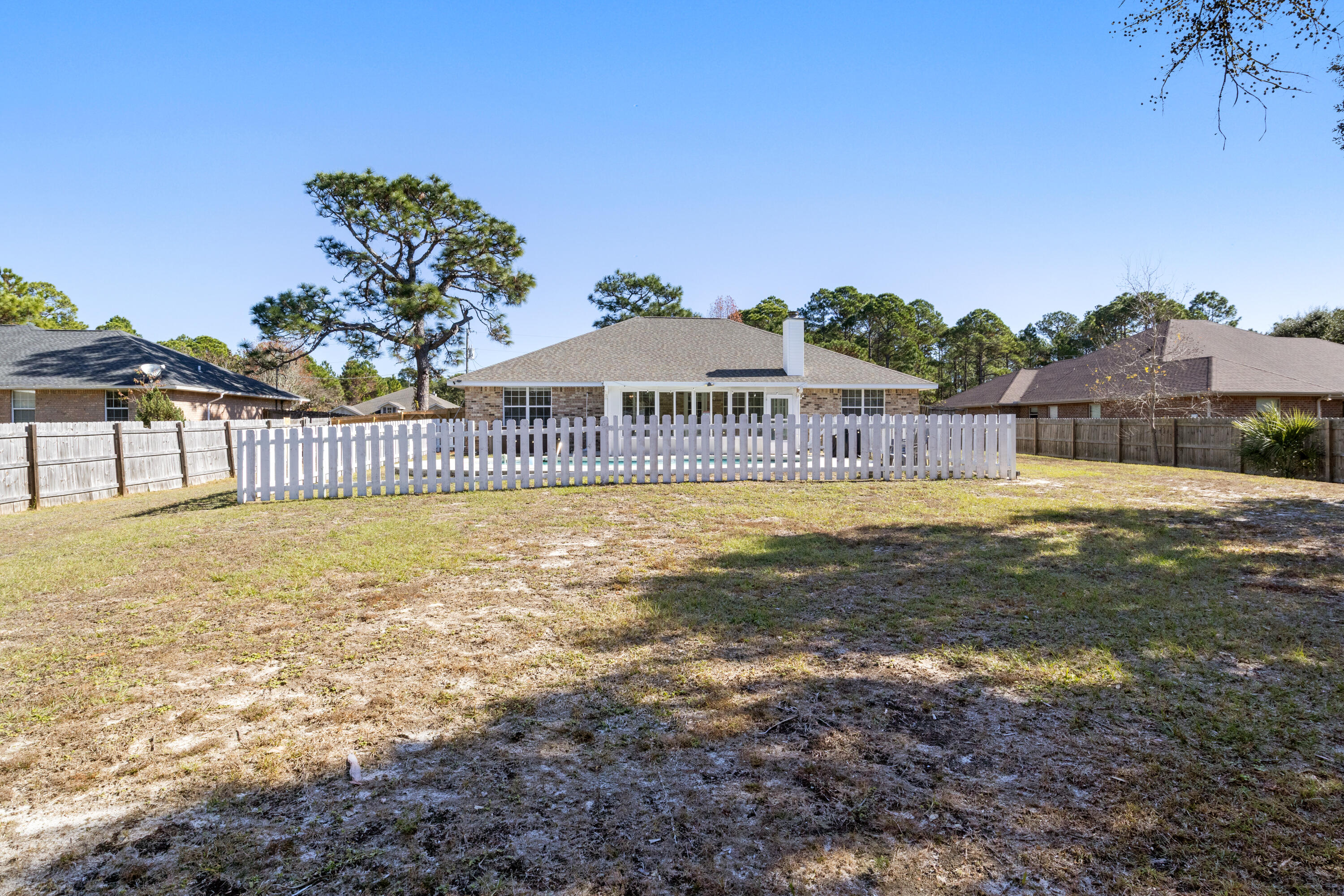 2005 Cardinal Lane Navarre, FL 32566 - Photo 31 of 37 a view of a house with a swimming pool