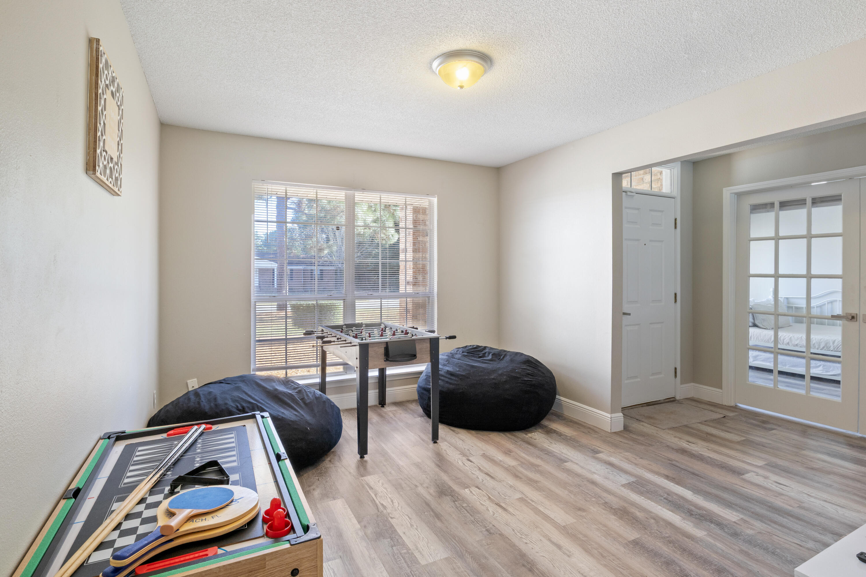 2005 Cardinal Lane Navarre, FL 32566 - Photo 4 of 37 a bedroom with a bed and a couch