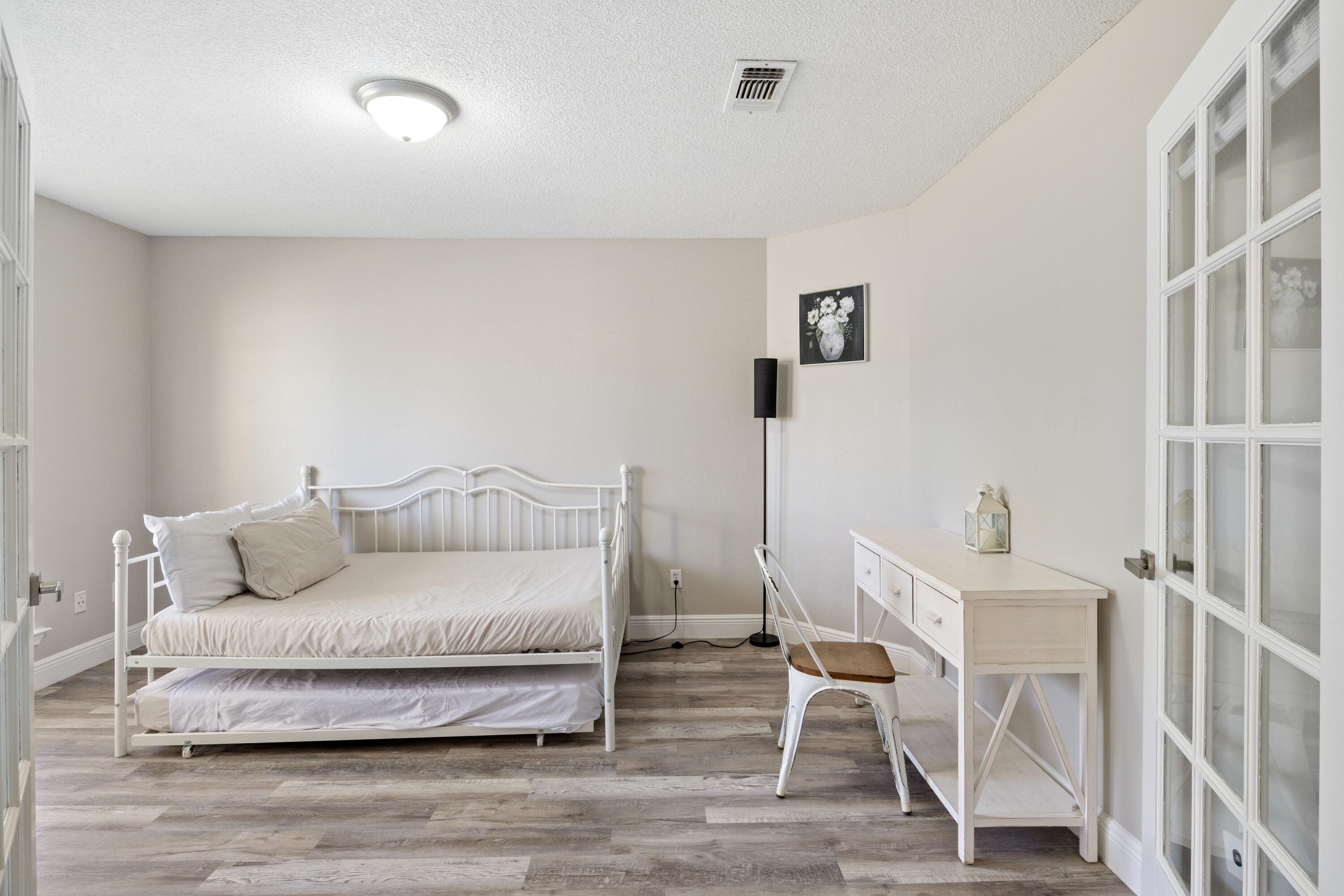 2005 Cardinal Lane Navarre, FL 32566 - Photo 6 of 37 a living room with a couch and a table