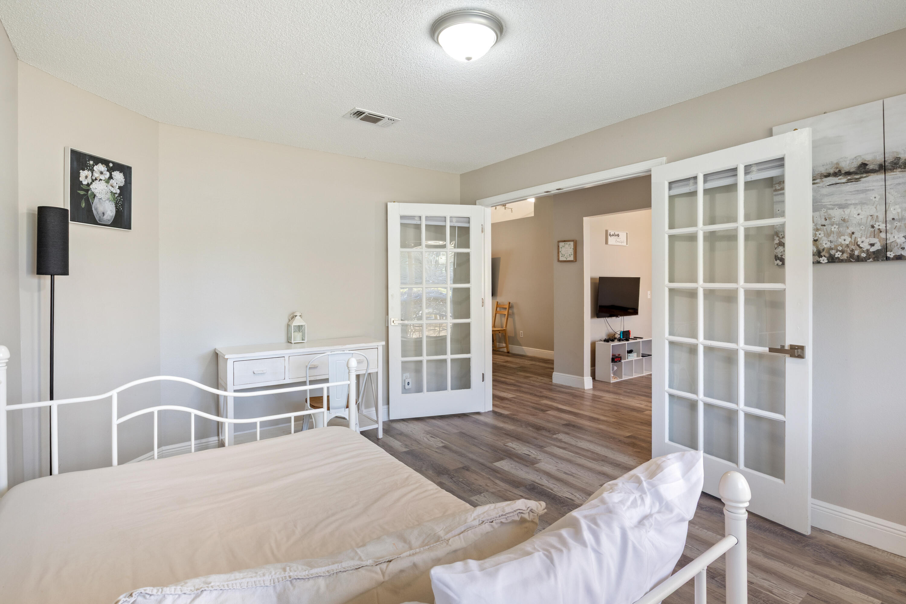 2005 Cardinal Lane Navarre, FL 32566 - Photo 7 of 37 a bedroom with a bed and wooden floor