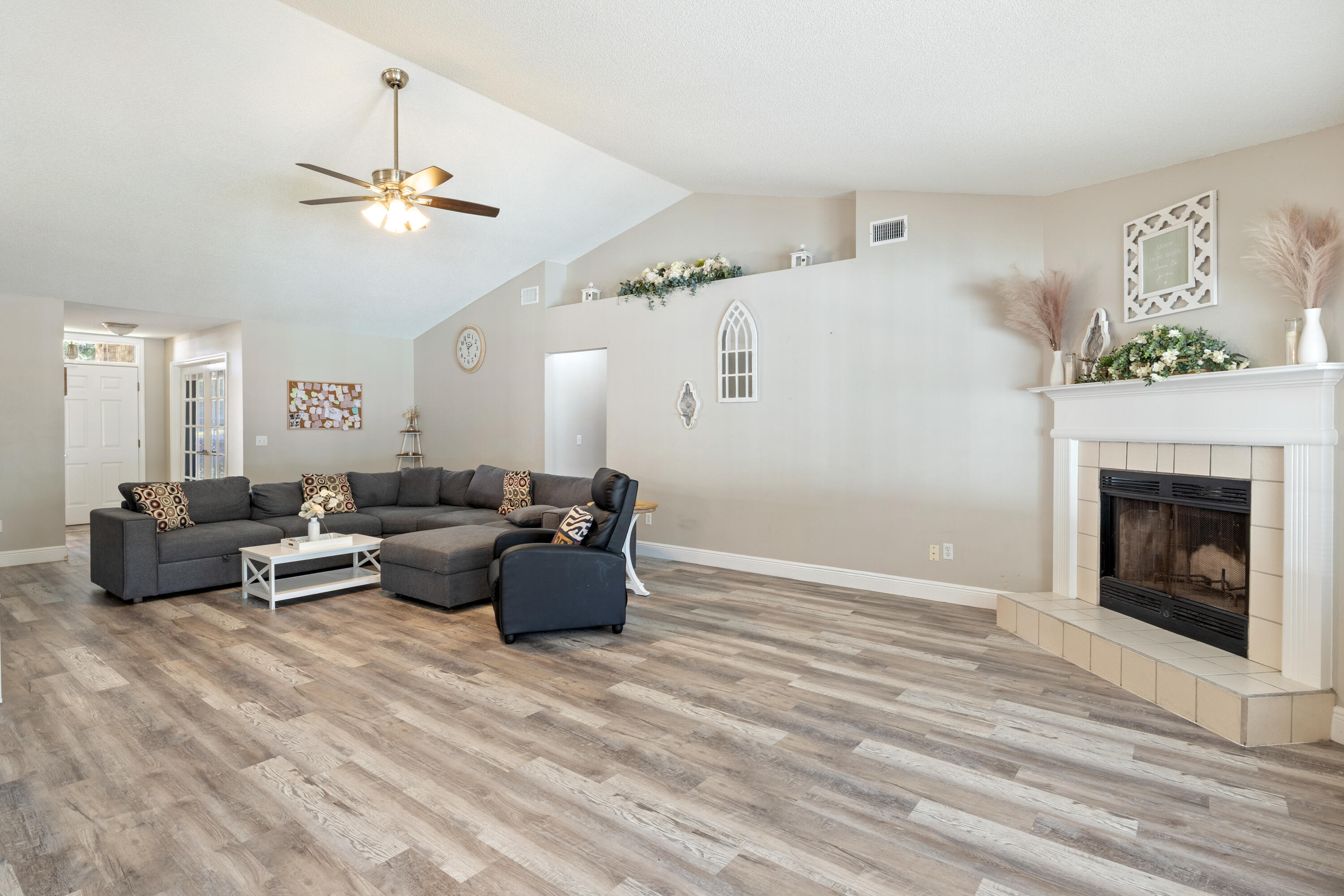 2005 Cardinal Lane Navarre, FL 32566 - Photo 9 of 37 a living room with furniture and a fireplace