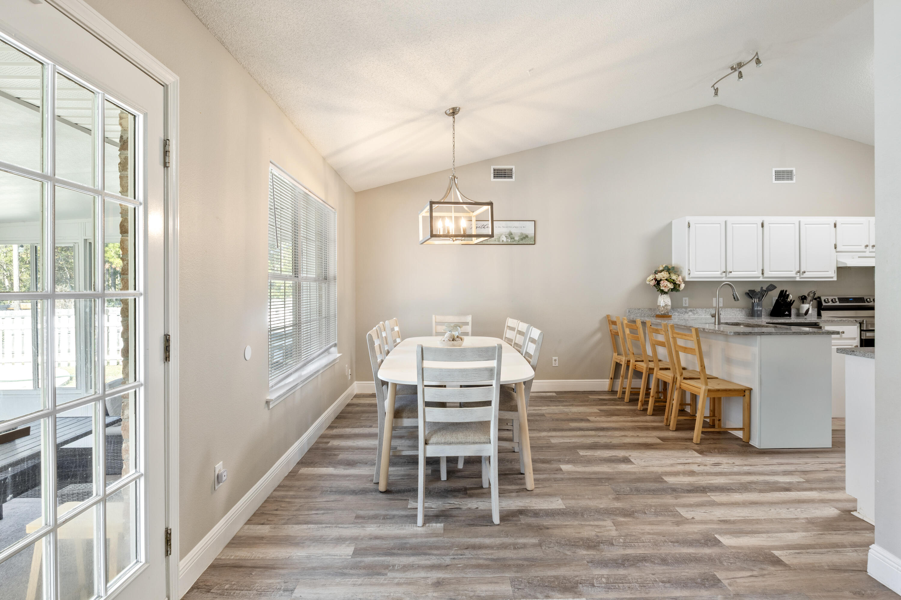 2005 Cardinal Lane Navarre, FL 32566 - Photo 10 of 37 a view of a dining room with furniture window and wooden floor