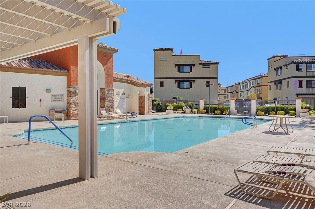 48 Jasmine Point Street Henderson, NV 89074 - Photo 8 of 62 A refreshing pool awaits, perfect for a sunny afternoon dip.