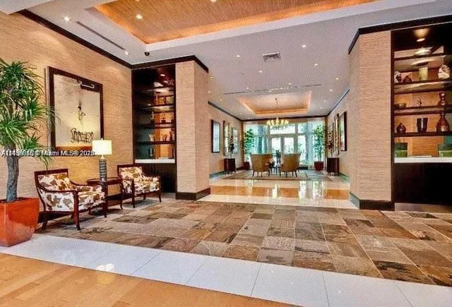 a view of a living room and kitchen floor
