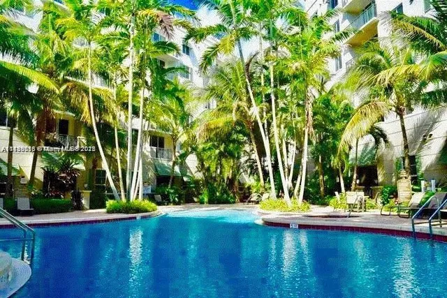 a view of swimming pool with a patio