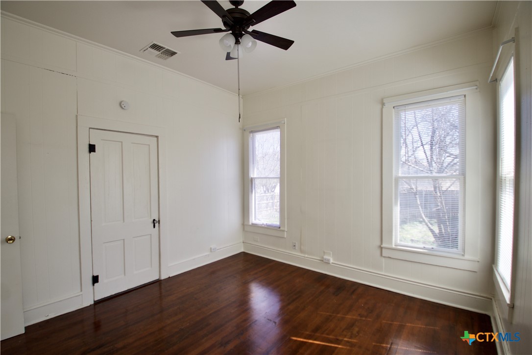 617 North 6th Street Temple, TX 76501 - Photo 34 of 38 a view of an empty room with wooden floor and a window
