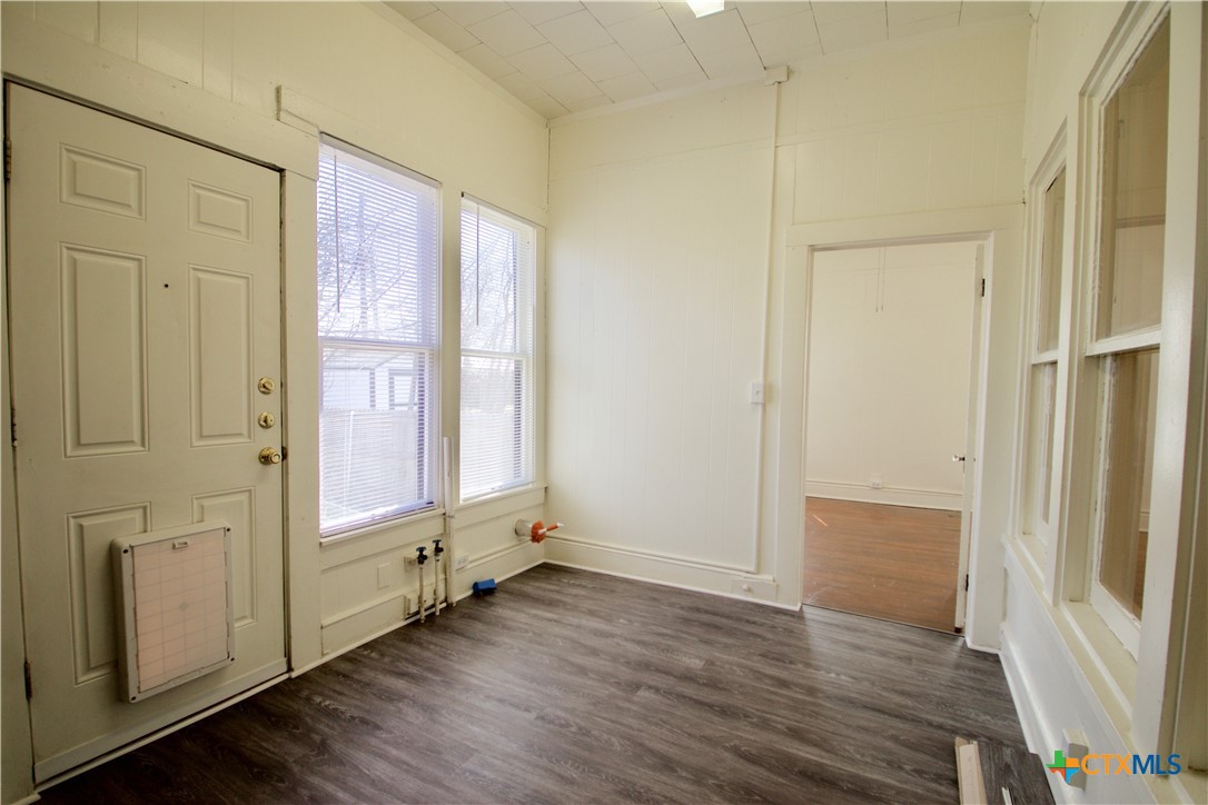 617 North 6th Street Temple, TX 76501 - Photo 38 of 38 an empty room with wooden floor and windows