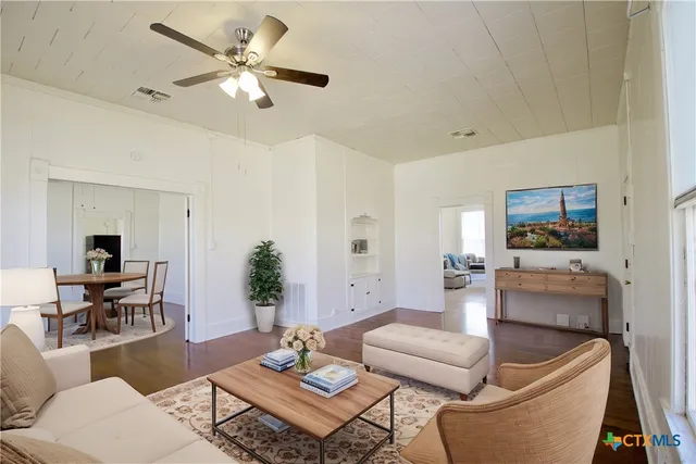 a living room with furniture and a table