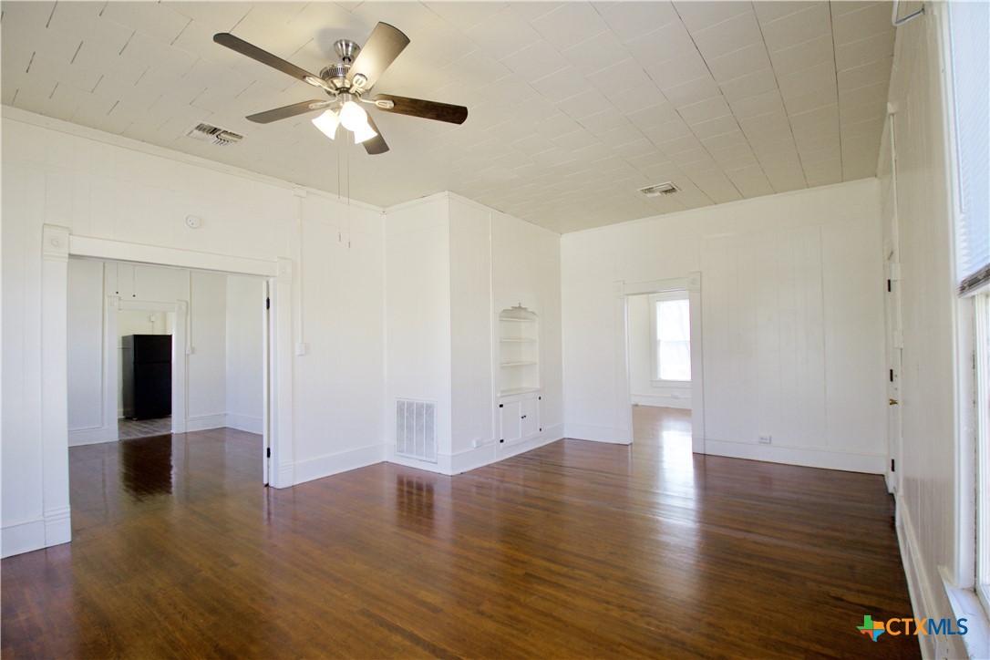 617 North 6th Street Temple, TX 76501 - Photo 6 of 38 a view of an empty room with wooden floor