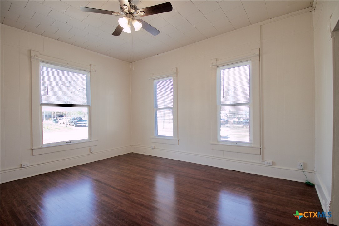 617 North 6th Street Temple, TX 76501 - Photo 8 of 38 a view of an empty room with wooden floor and a window