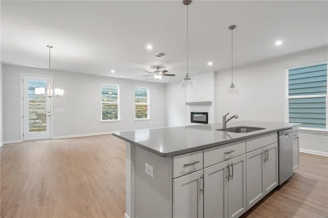 a kitchen with sink cabinets and window