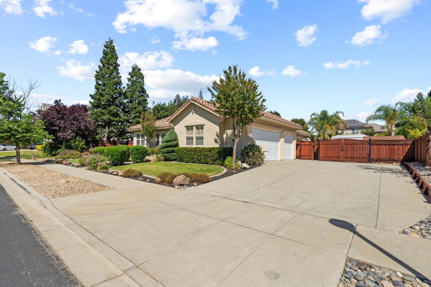 2434 Lakeside Circle Livermore, CA 94550 - Photo 2 of 35 a front view of a house with a yard and garage