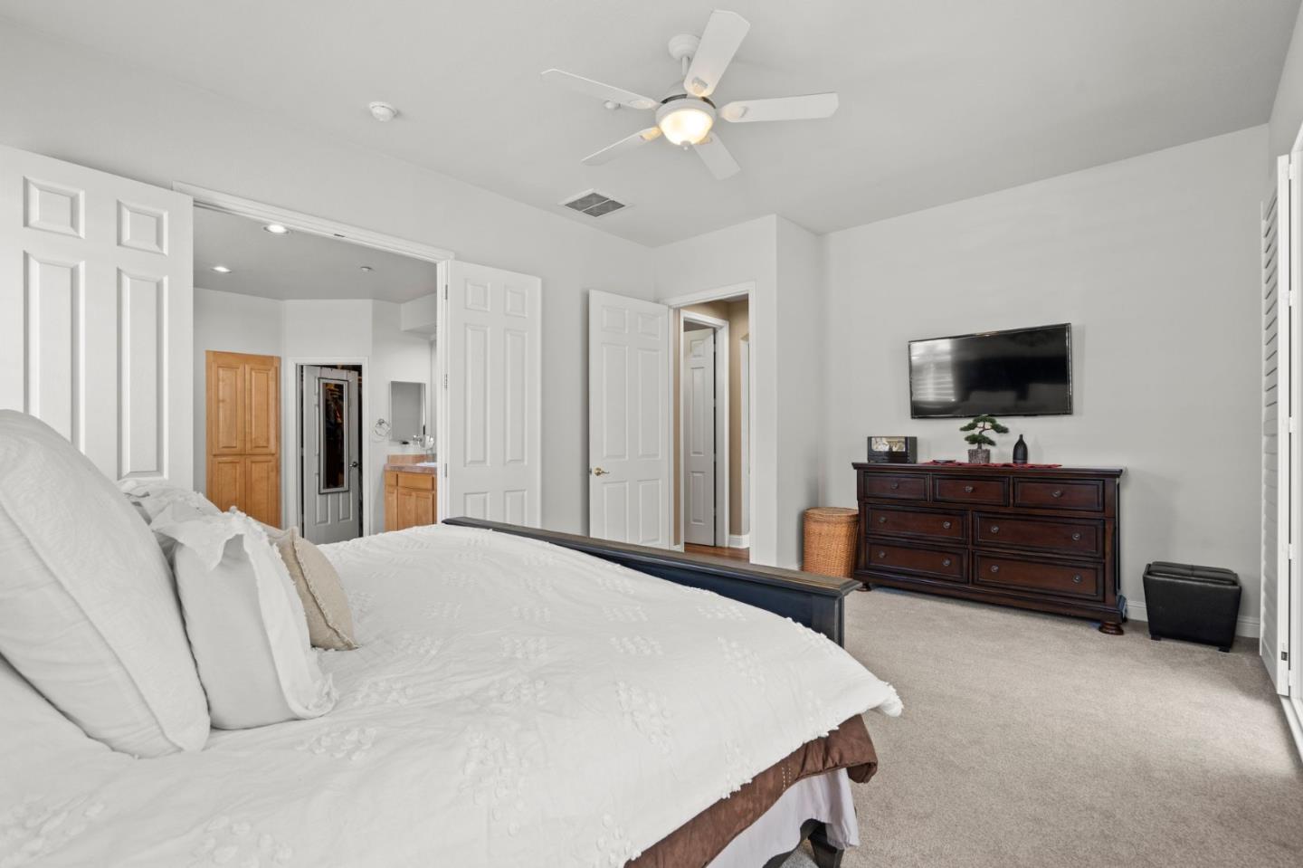2434 Lakeside Circle Livermore, CA 94550 - Photo 23 of 35 a bedroom with a bed and a flat screen tv