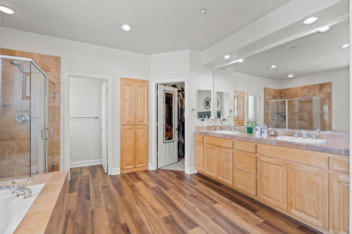 2434 Lakeside Circle Livermore, CA 94550 - Photo 25 of 35 a bathroom with a sink and a large mirror