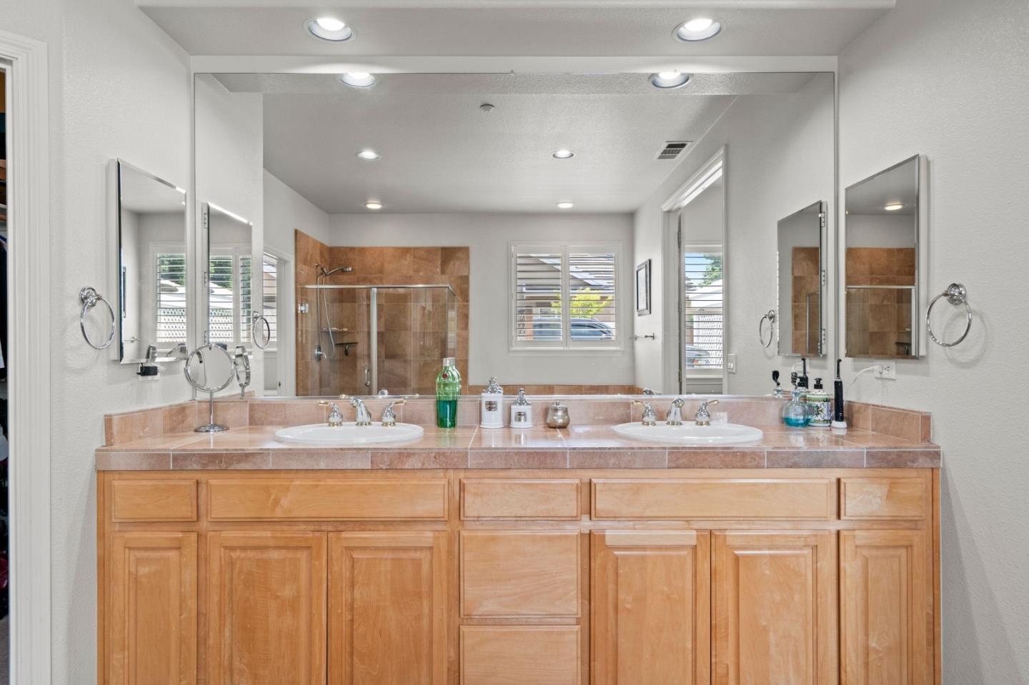 2434 Lakeside Circle Livermore, CA 94550 - Photo 26 of 35 a bathroom with a granite countertop sink mirror and a