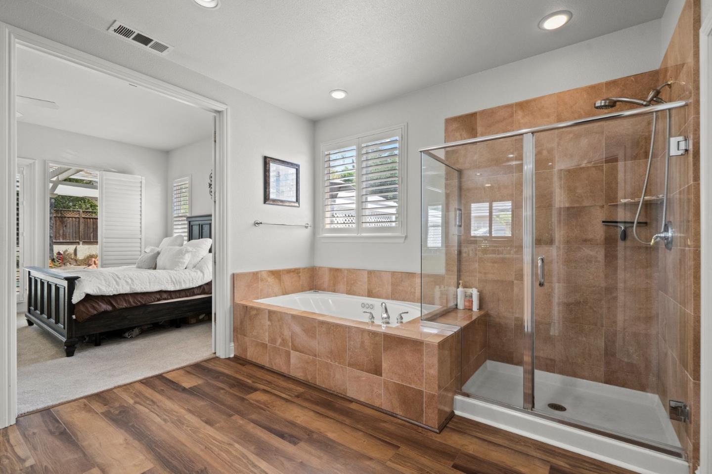 2434 Lakeside Circle Livermore, CA 94550 - Photo 27 of 35 a bathroom with a tub a sink and a large mirror