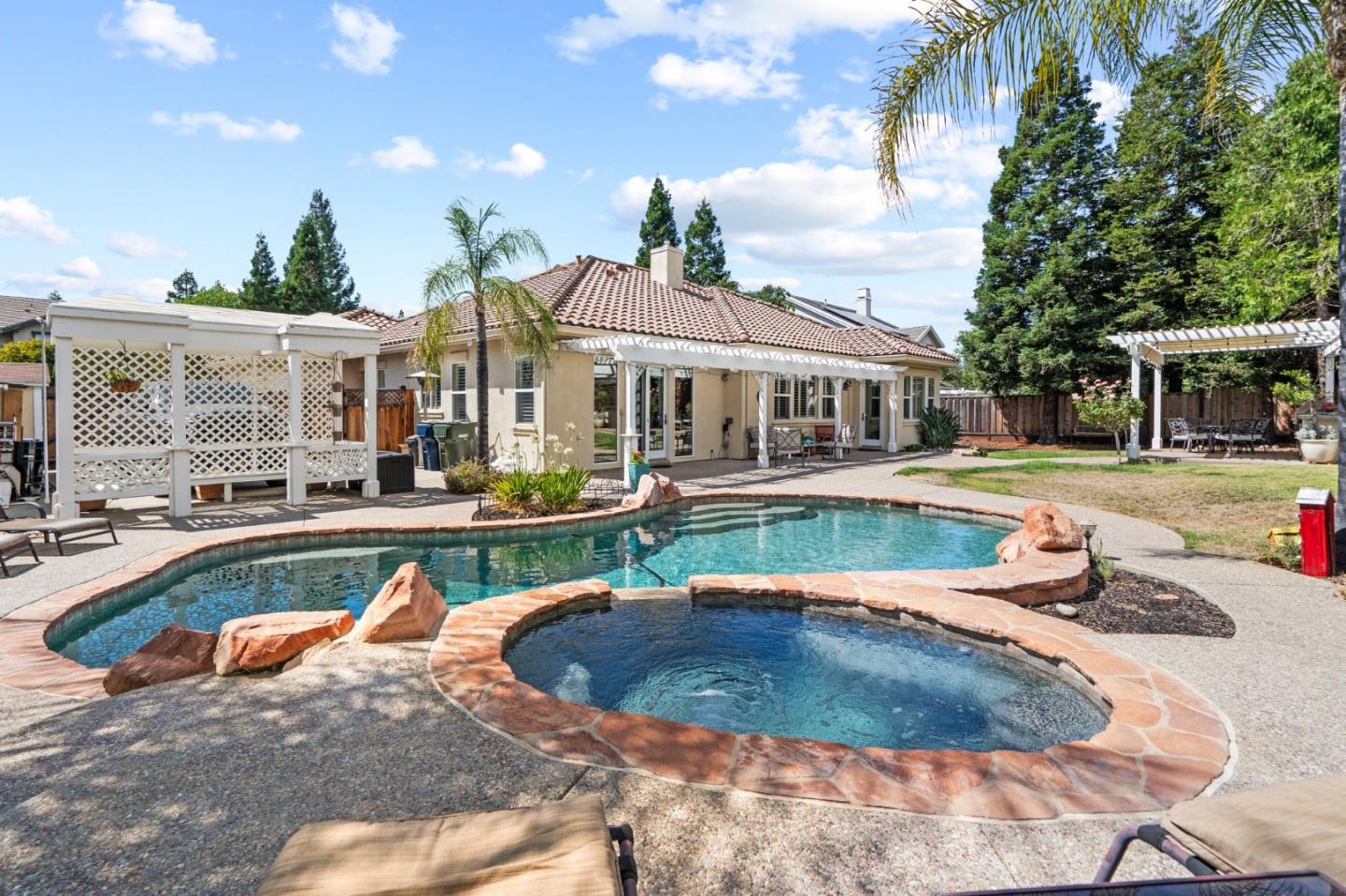 2434 Lakeside Circle Livermore, CA 94550 - Photo 29 of 35 a view of a house with swimming pool and a yard