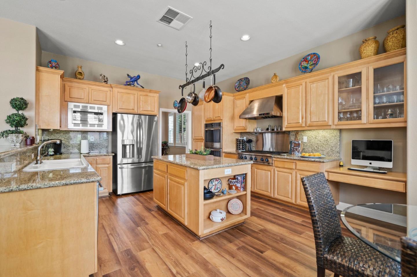 2434 Lakeside Circle Livermore, CA 94550 - Photo 9 of 35 a kitchen with stainless steel appliances granite countertop a sink a stove and a refrigerator