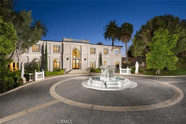 a view of a house with a swimming pool