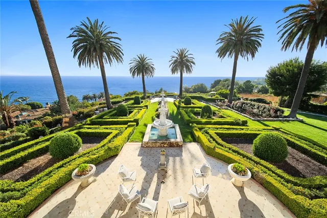 a house with palm tree in front of it