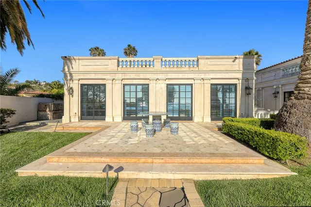 a living room with a table chairs and a table