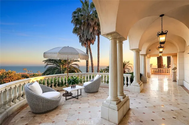 a view of a chair and tables on the roof deck