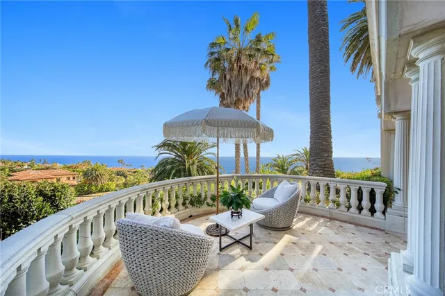 a view of a swimming pool with a table and chairs