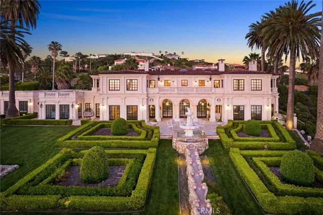 a view of a swimming pool with a table and chairs