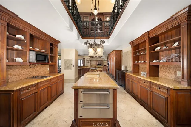a kitchen with stainless steel appliances granite countertop a sink and stove