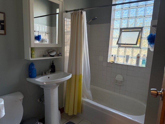 3330 West Evergreen Avenue Chicago, IL 60651 - Photo 12 of 16 a bathroom with a sink a toilet and shower